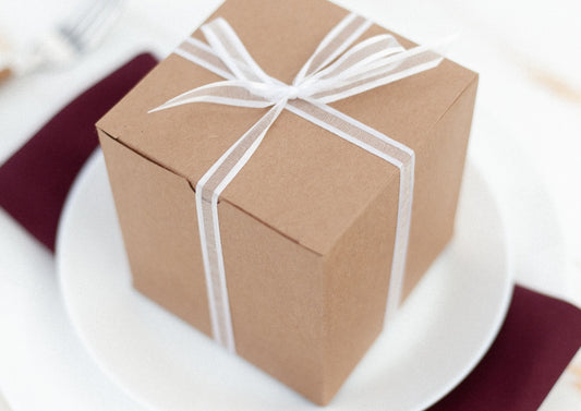 Card box wrapped with ribbon at a table