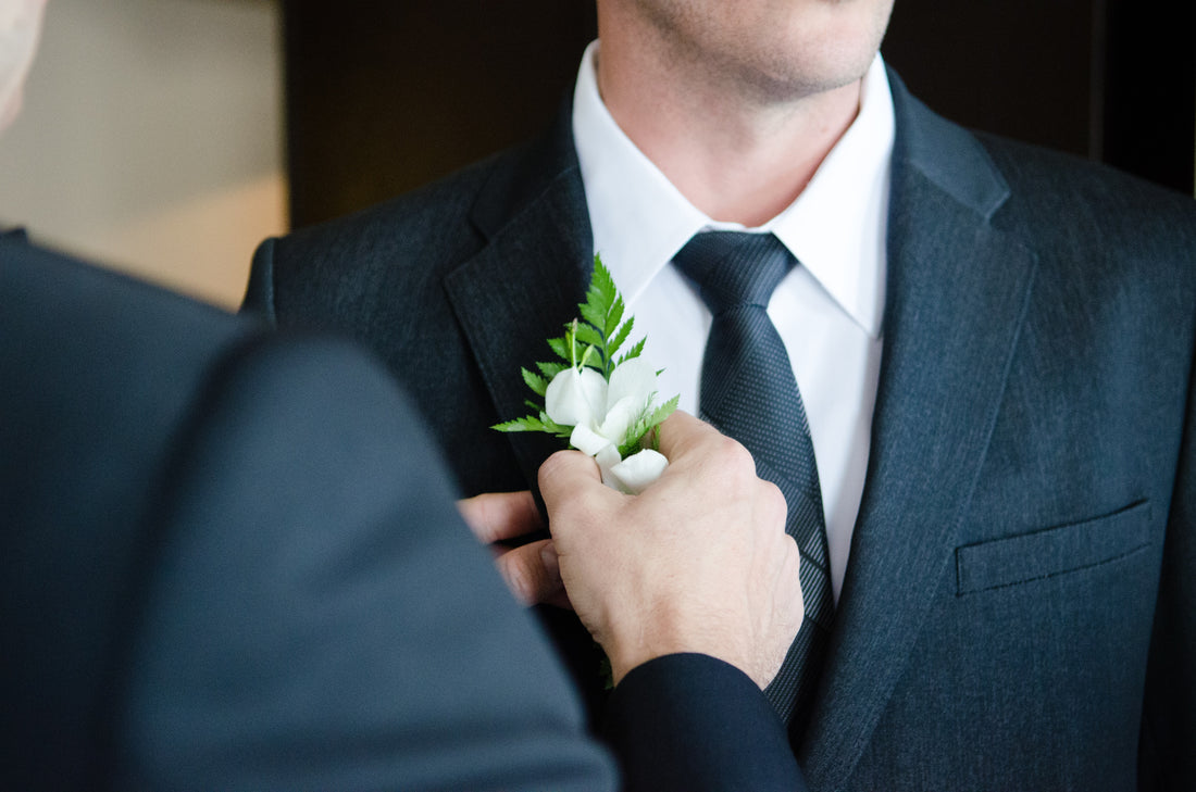 A man getting ready for a wedding